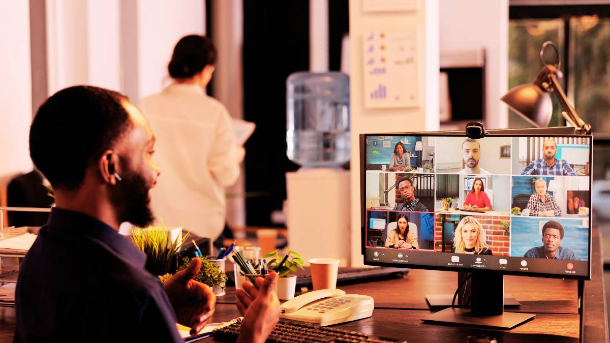 guy having video conference with his remote team